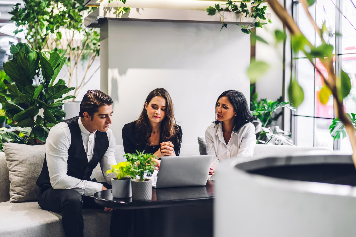 business group around laptop