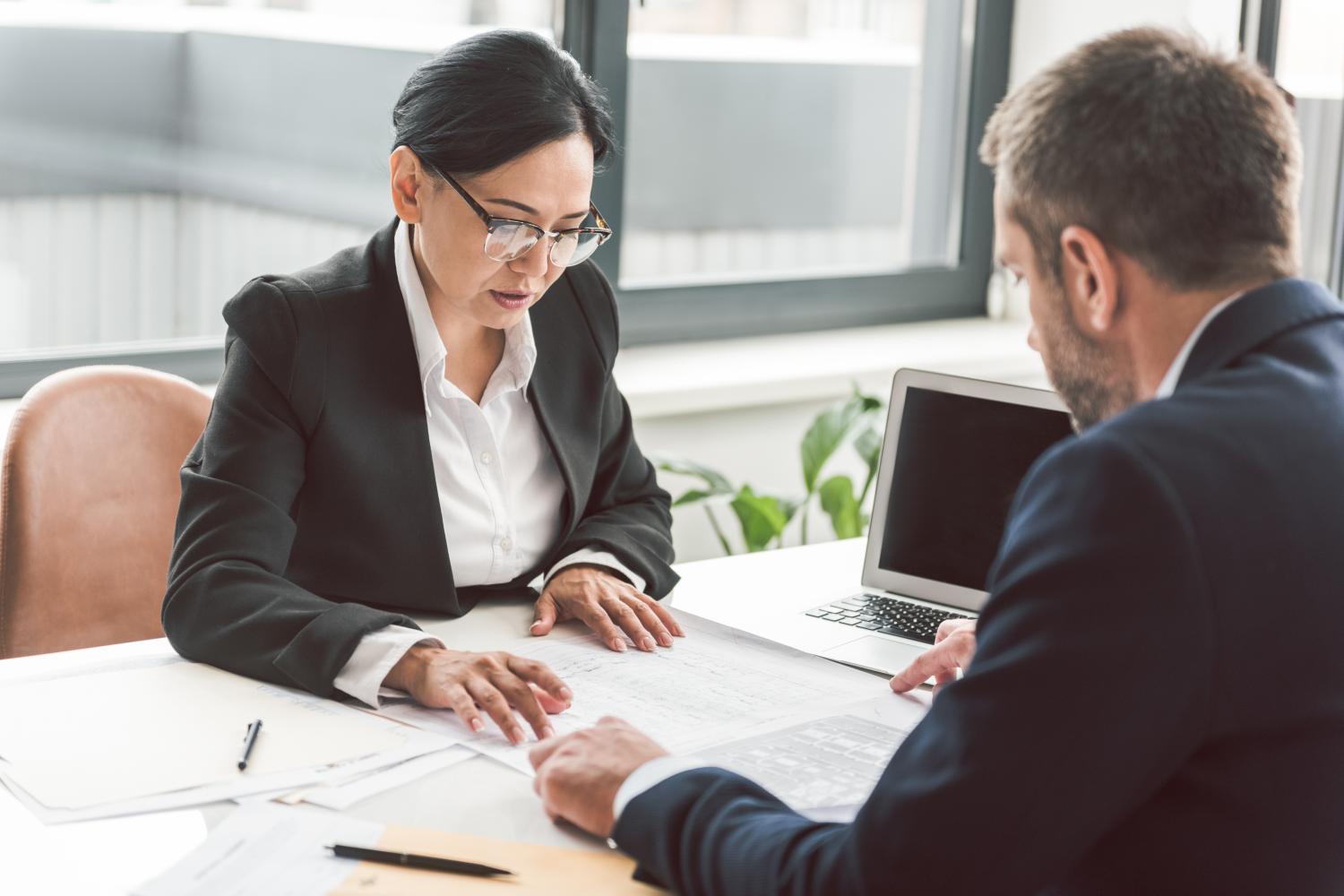 business lady and man with documents