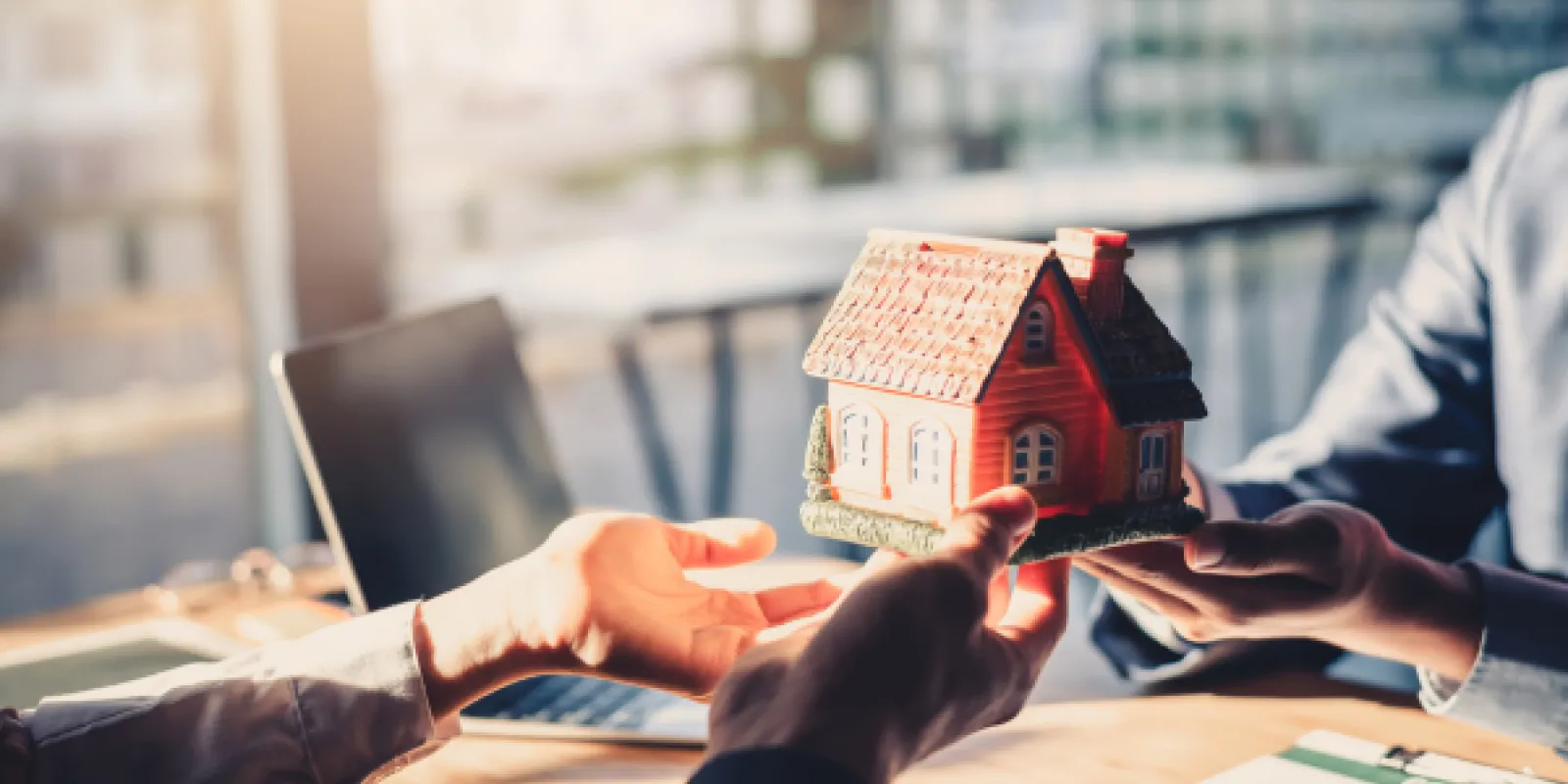man handing over a house