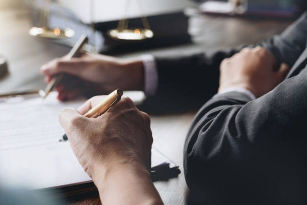 lawyers signing contracts