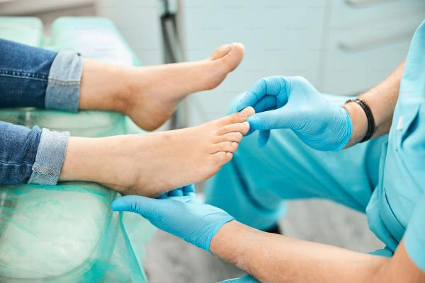 doctor checking feet