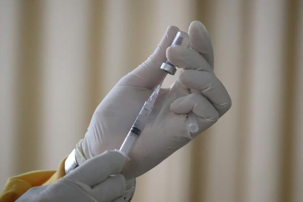 Doctor administering injections